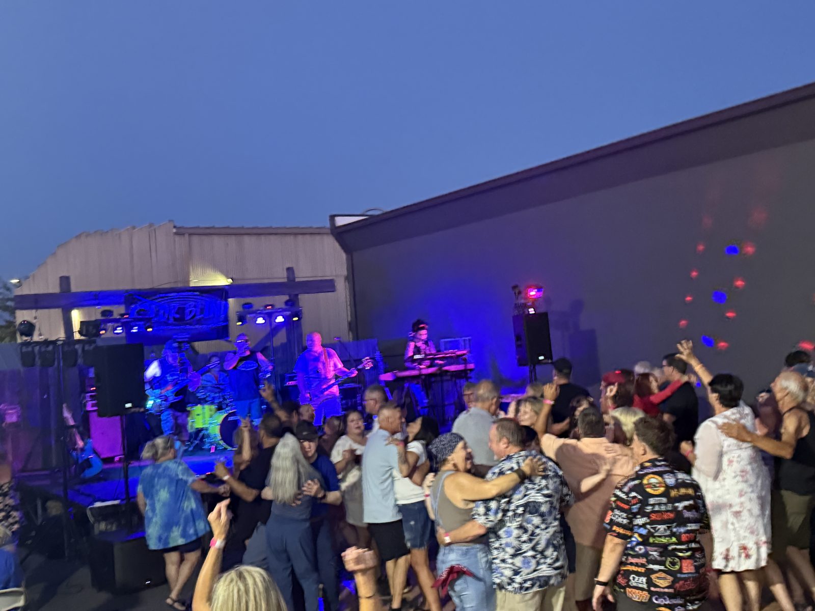 Crowd dancing to live music at Sam's Saloon Stage Left Summer Concert Series in Kennewick, WA